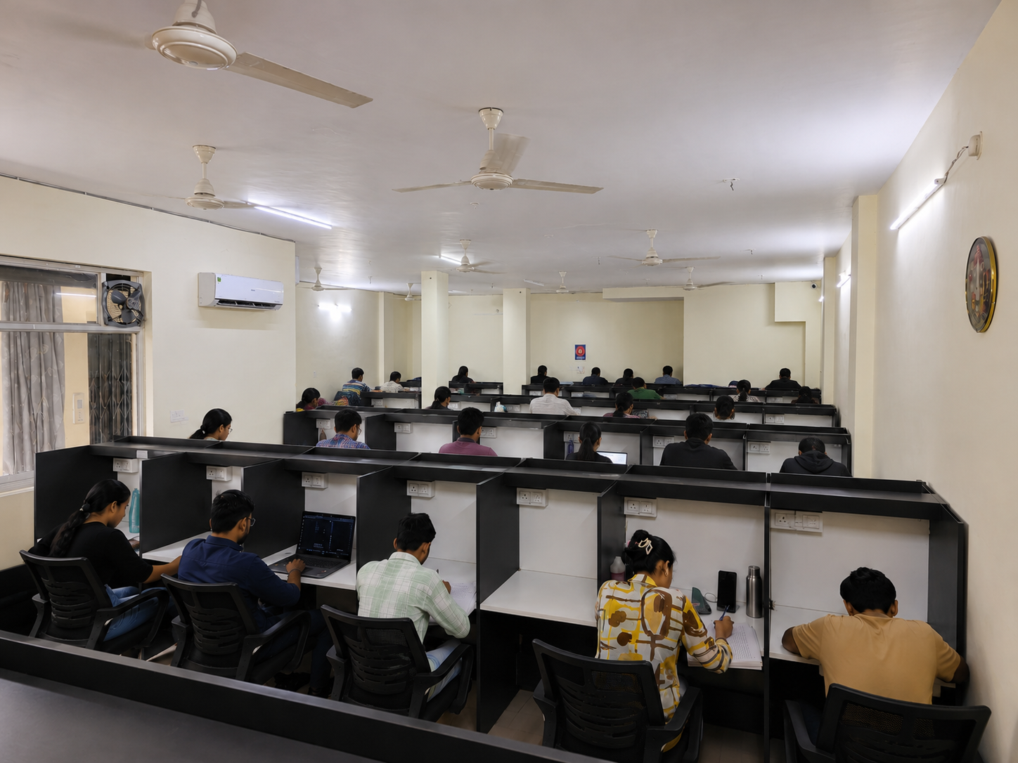 Modern Self Study Library Hall in Indore with Individual Study Cabins, Comfortable Seating, Air Conditioning, and Students Studying in a Peaceful Environment